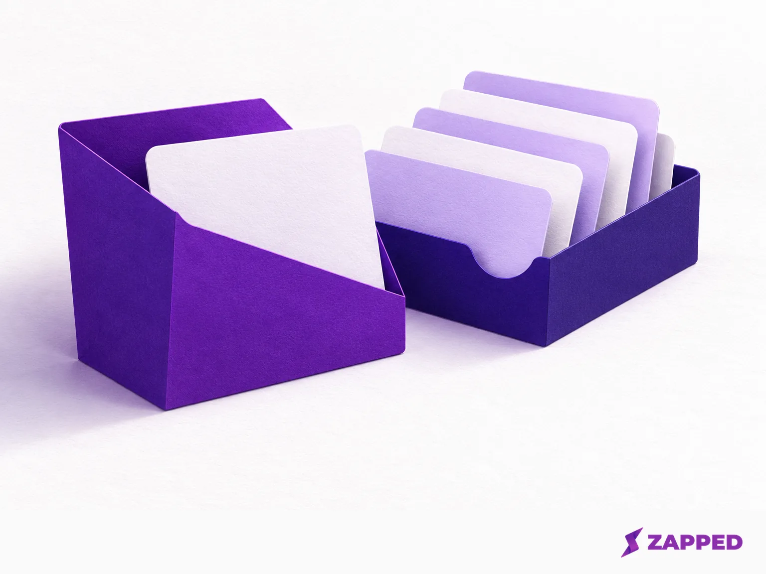 A blank contact-file sleeve with one preview card beside a tray of several unlabelled saved contact cards.