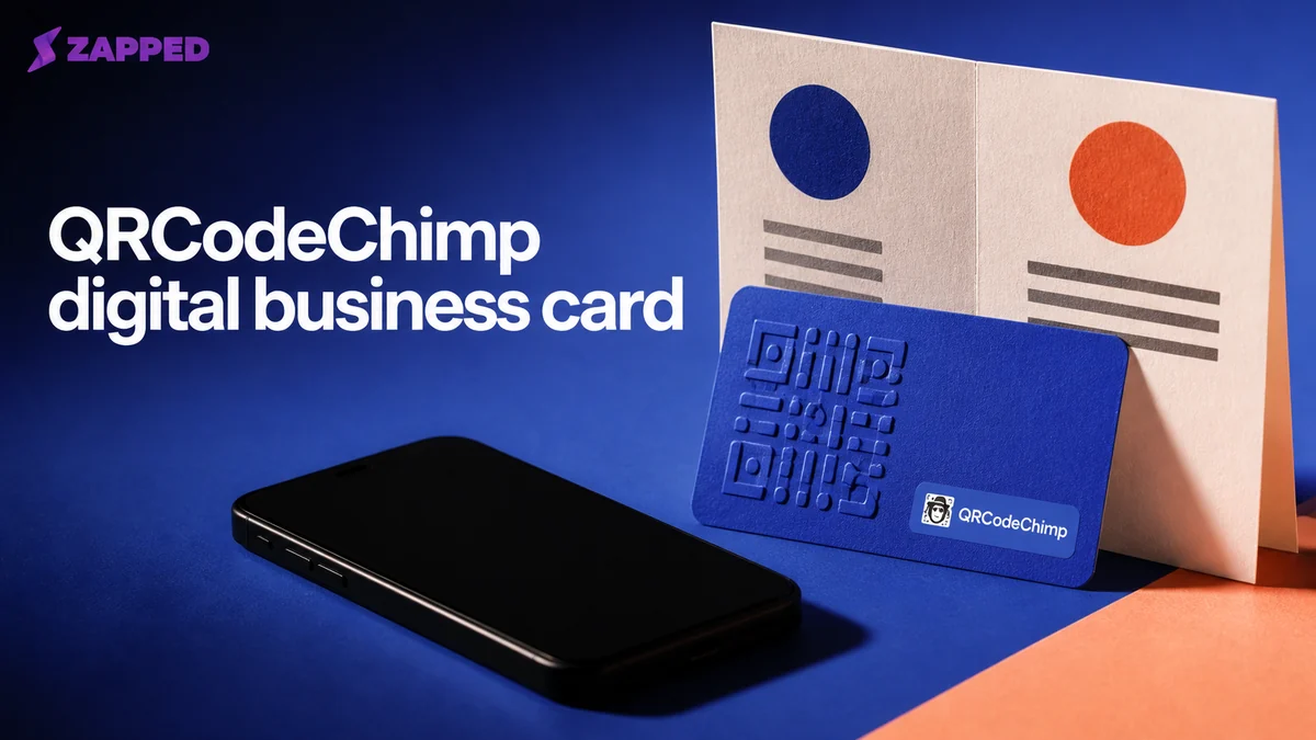 QRCodeChimp digital business card review with a branded QR card and phone beside a comparison sheet
