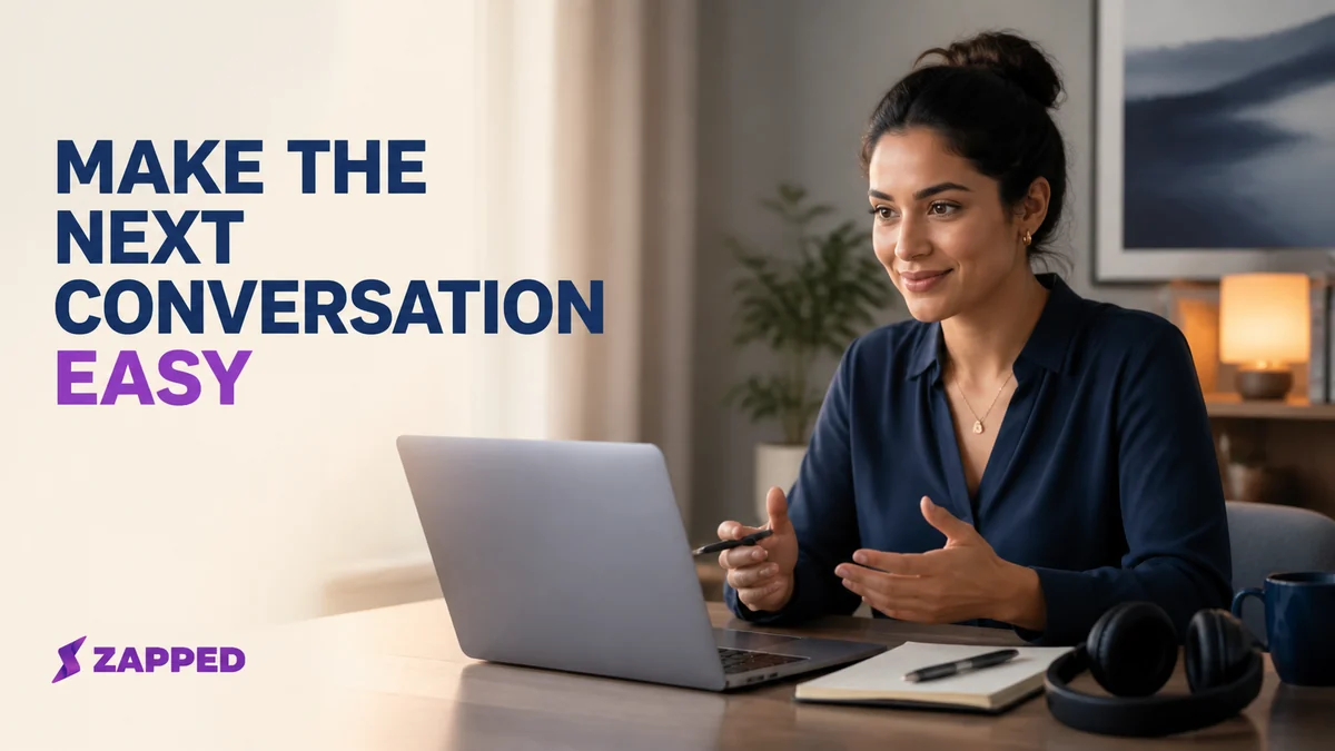 Professional preparing for a virtual networking conversation at a laptop with notes and headphones nearby
