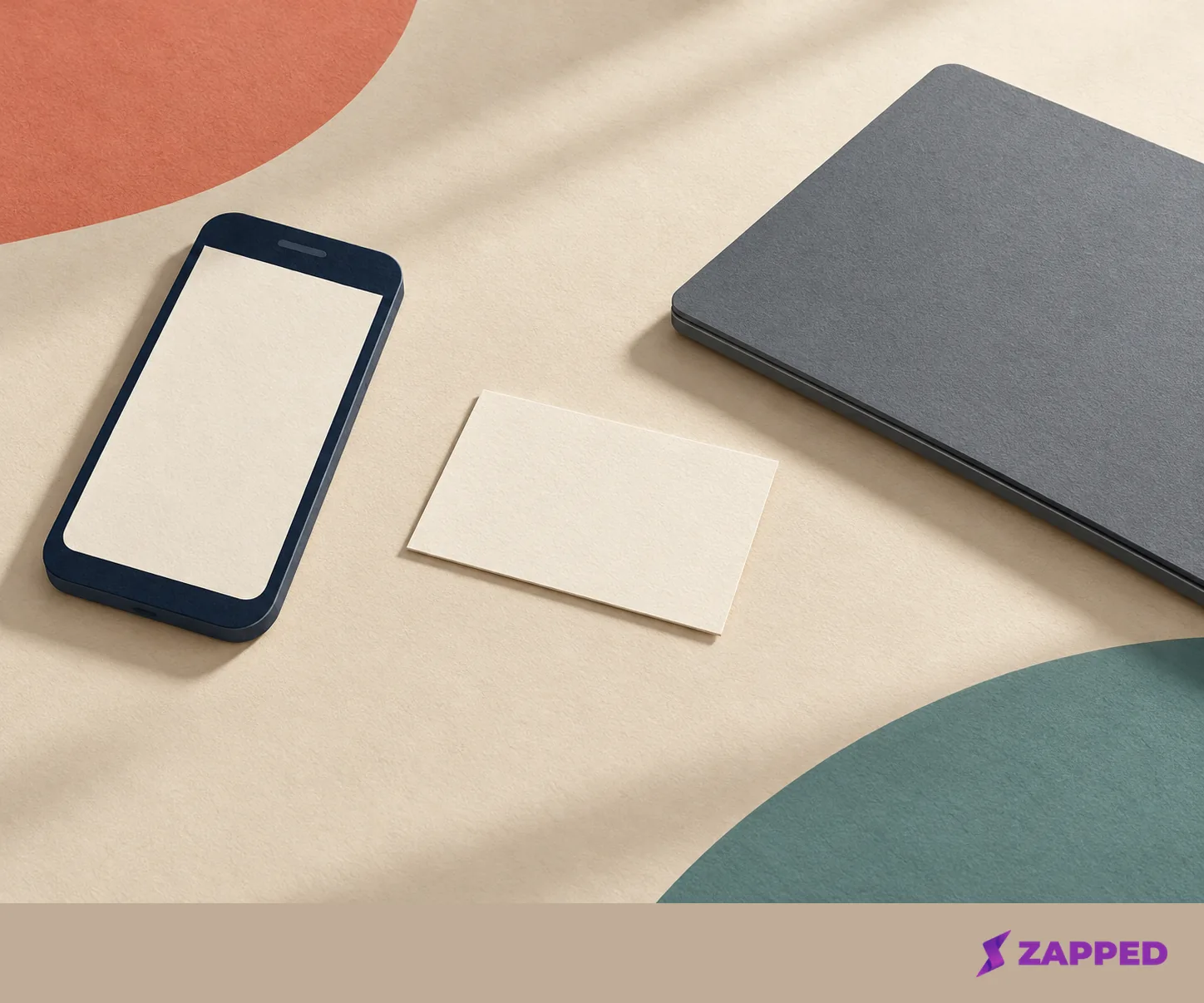 Unlabelled phone, laptop, and business card arranged as simple objects for choosing a Lens route.
