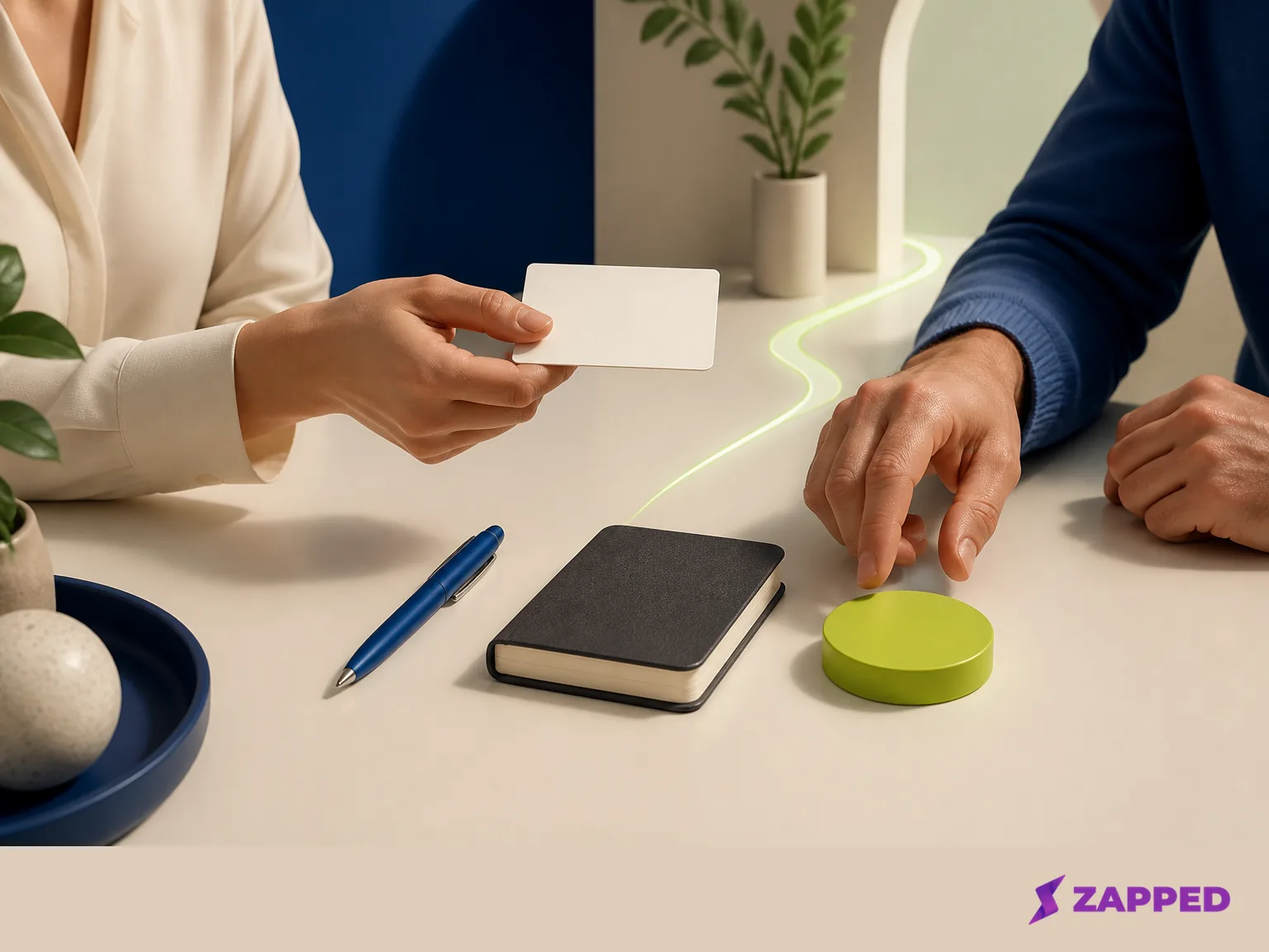 A professional handoff of a blank profile card leads toward a next step on a shared table